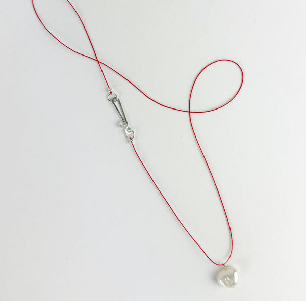 The Silk and Pearl Necklace
